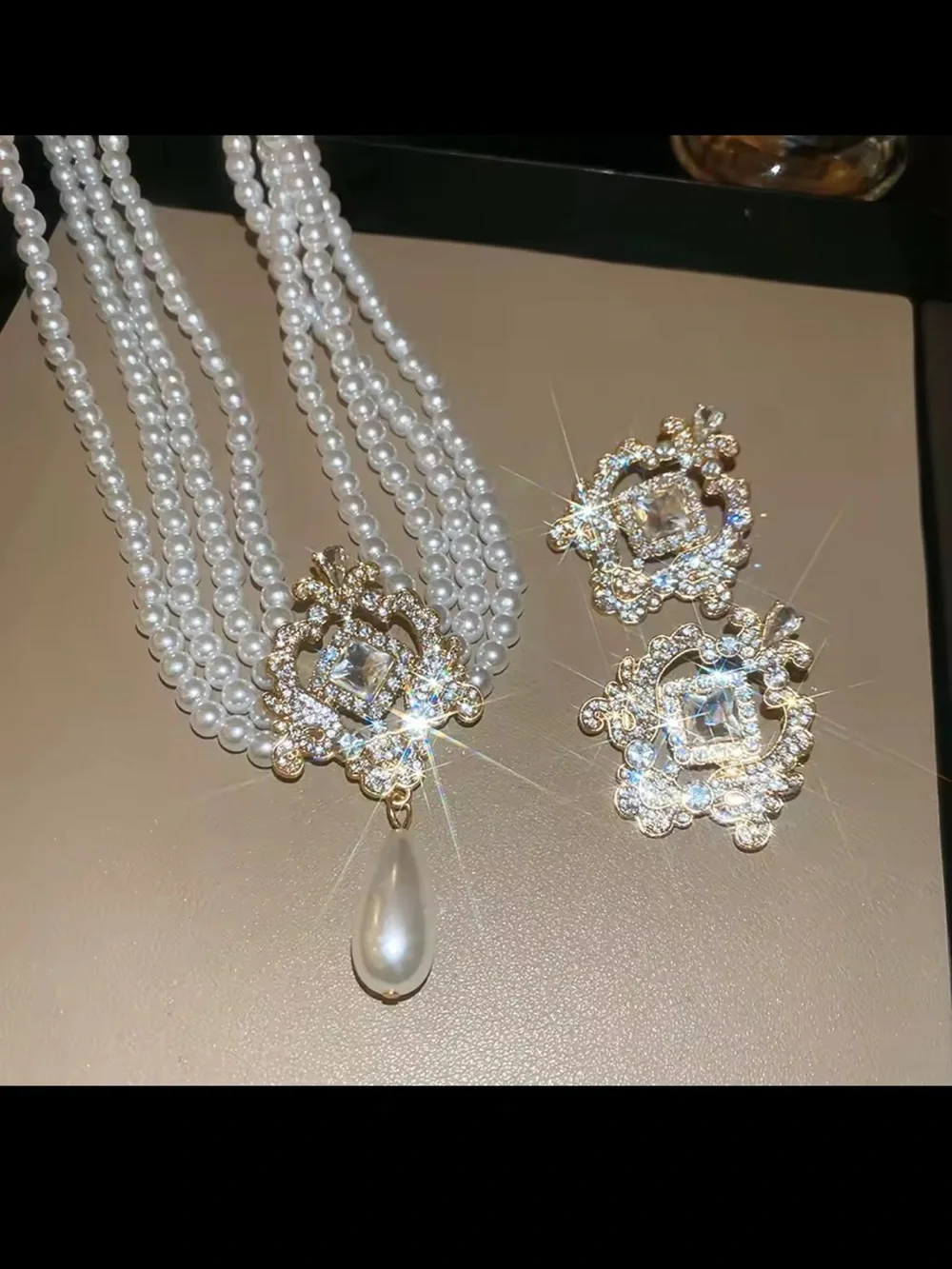 White Pearl Multi-Strand Necklace and Earring set with Gold and Crystal Pendant